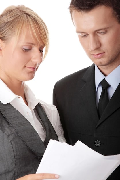 Image of contract or legal document related to cancellation of a show, showing legal team looking concerned.