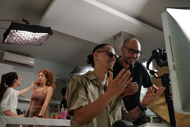 A production scene with diverse crew members filming a scene; focus on the camera and actors, bright and professional lighting.