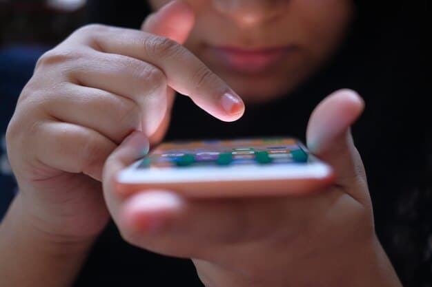 Close-up shot of a person holding a remote control, with the TV screen showing a streaming app interface with crisp, clear images.