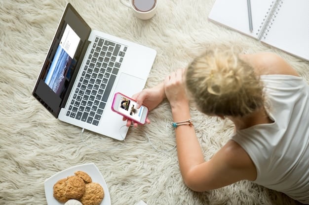 A person sitting on a couch with a laptop, focused on their laptop screen, with a smartphone displaying a calendar reminder set for canceling a streaming subscription trial.
