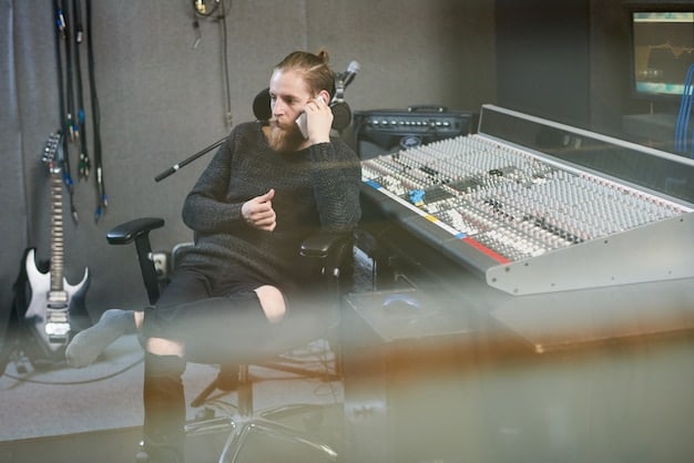 A sound engineer working in a professional recording studio, surrounded by mixing consoles and audio equipment. The engineer is focused on adjusting sound levels, highlighting the technical expertise involved in sound design.