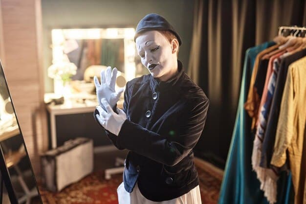 A costume designer meticulously adjusting the collar of a period-accurate gown on a film set. The designer is surrounded by racks of clothing and fabric samples.