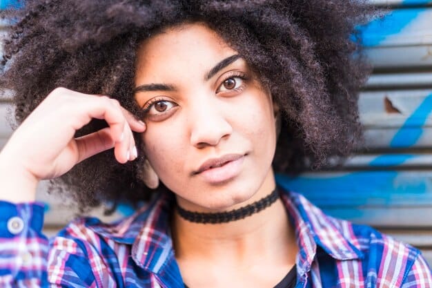 Close-up shot of Zendaya as Rue Bennett looking distressed, with teary eyes and a pained expression, possibly during a withdrawal episode. The background is blurred, emphasizing her isolation and internal struggle.