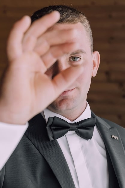A close-up shot of the bachelor during a particularly emotional rose ceremony, showing his face etched with the difficulty of choosing which contestants to eliminate.