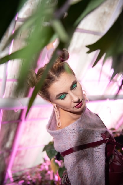 Sydney Sweeney portraying Cassie in Euphoria season 2, showcasing a scene with exaggerated makeup and a highly emotional expression, which captures the character's spiraling behavior due to her romantic entanglement.