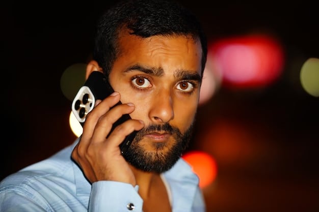 Close-up shot of Kendall Roy on the phone, his face etched with worry and disbelief. He is trying to maintain composure, but the stress is visible in his eyes. The background is blurred, suggesting the chaos around him, but his focus remains on the call.