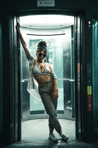 A close-up shot of Shiv Roy in the elevator on her way to the Waystar RoyCo offices, her expression a mix of ambition, anxiety, and uncertainty as she prepares for the crucial vote.