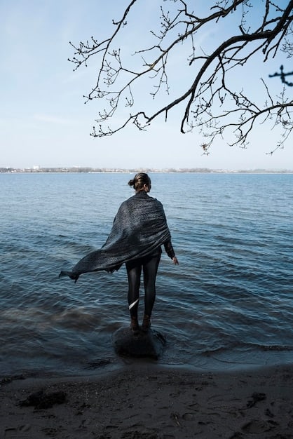 A solitary figure of Kendall staring out at the ocean in the final scene, showing his despair and shattered dreams after losing control of Waystar RoyCo.