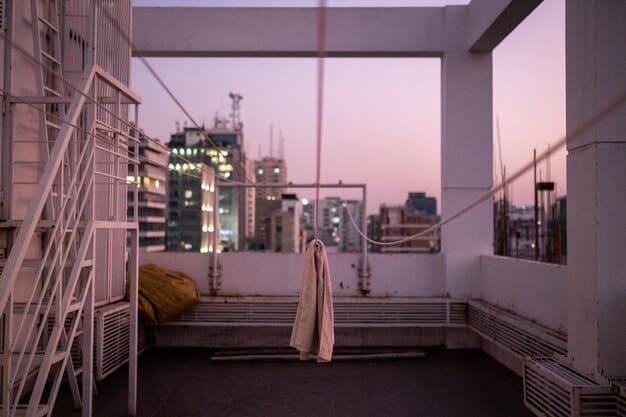 A scene set in a modern, high-rise apartment showing Shiv Roy (Sarah Snook) having a tense conversation with Tom Wambsgans (Matthew Macfadyen). Shiv stands near a floor-to-ceiling window, looking pensive and conflicted, while Tom stands a few feet away, his body language conveying anxiety and uncertainty. The atmosphere is heavy with unspoken tension and strained emotions.