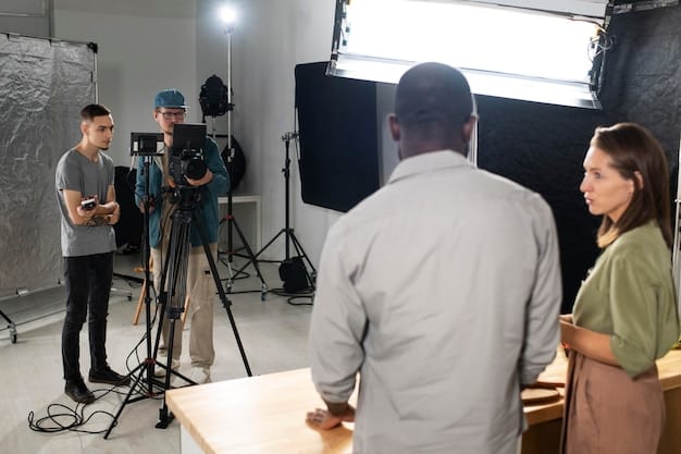 A behind-the-scenes shot from a movie set, showing a director giving instructions to the cast and crew, highlighting the complex process of film production.