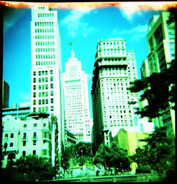 A split-screen image contrasting the futuristic cityscape from 