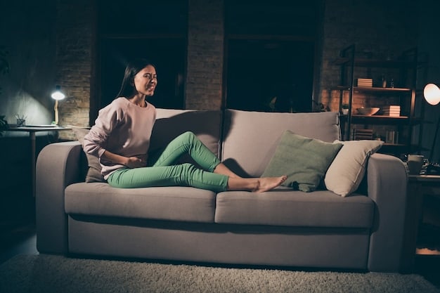A person sitting on a couch in a darkened living room, illuminated by the glow of a laptop screen. The screen displays a chilling scene from a horror movie, and the person's face is a mix of fear and excitement.