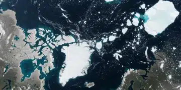 Satellite view of significant Arctic ice loss, showing fragmented ice and open water
