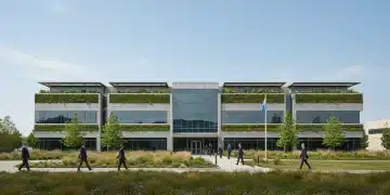 Modern corporate building with green infrastructure, symbolizing U.S. corporate climate resilience.