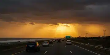 Evacuation route sign with cars fleeing coastal storm