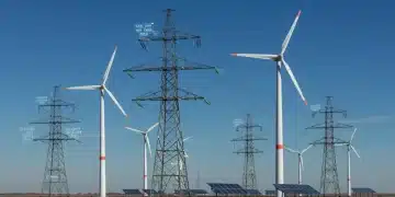 Modern power grid integrating wind turbines and solar panels, symbolizing renewable energy interconnection policies.