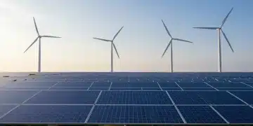 Solar panels and wind turbines symbolizing renewable energy tax credits and federal incentives for 2026.